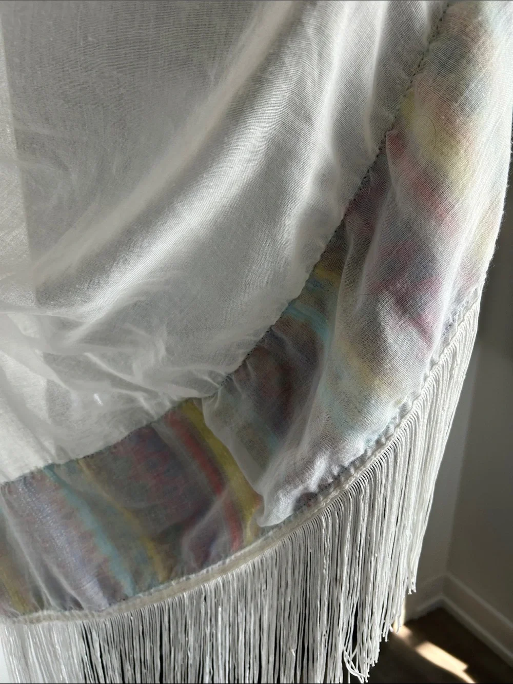 World Market white fringe scarf with red blue yellow green stitching